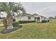 House exterior, single-story home with palm tree and lawn at 5247 Nw 18Th St, Ocala, FL 34482