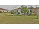 Quaint house exterior with lush landscaping and a screened porch at 5247 Nw 18Th St, Ocala, FL 34482
