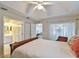 Bright bedroom with a comfortable bed and ensuite bathroom access at 5247 Nw 18Th St, Ocala, FL 34482