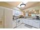 Well-equipped kitchen with white cabinets and appliances at 5247 Nw 18Th St, Ocala, FL 34482
