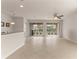 Large living room with tile floors and sliding glass doors at 7127 Sw 91St Ct, Ocala, FL 34481