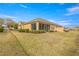 Spacious backyard with screened patio and lush landscaping at 7127 Sw 91St Ct, Ocala, FL 34481