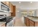 Kitchen with stainless steel appliances and wood cabinets at 7127 Sw 91St Ct, Ocala, FL 34481