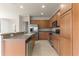 Modern kitchen with stainless steel appliances and light wood cabinets at 7127 Sw 91St Ct, Ocala, FL 34481