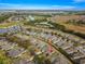 An aerial view of a single house among other homes in a community at 7127 Sw 91St Ct, Ocala, FL 34481