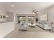 Open living room with tile floors and view of backyard at 7127 Sw 91St Ct, Ocala, FL 34481