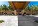 Elegant clubhouse entrance with covered walkway and palm trees at 4336 Nw 55Th Ct, Ocala, FL 34482