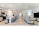 Open concept kitchen with stainless steel appliances and island, flows into living area at 4336 Nw 55Th Ct, Ocala, FL 34482