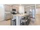 Open kitchen boasts granite countertops, stainless steel appliances, and an island with seating at 4336 Nw 55Th Ct, Ocala, FL 34482