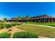 Community clubhouse with palm trees and manicured landscaping at 4336 Nw 55Th Ct, Ocala, FL 34482