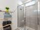 Bathroom with a large walk-in shower and gray tile at 4336 Nw 55Th Ct, Ocala, FL 34482