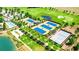 Aerial view of tennis and pickleball courts near a lake at 4336 Nw 55Th Ct, Ocala, FL 34482