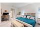 Main bedroom with king bed, dresser, and home office workspace at 4336 Nw 55Th Ct, Ocala, FL 34482