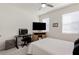 Bedroom with a bed, workspace, and large windows at 4336 Nw 55Th Ct, Ocala, FL 34482