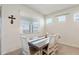 Bright dining area with wood table and chairs, and window with blinds at 4336 Nw 55Th Ct, Ocala, FL 34482