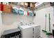 Laundry room with washer, dryer, and storage shelves at 4336 Nw 55Th Ct, Ocala, FL 34482