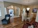 Bright dining room with glass table and hardwood floors at 7929 Sw 115Th Loop, Ocala, FL 34476