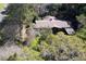 Aerial view of a ranch house surrounded by many trees at 3751 Se 3Rd Ave, Ocala, FL 34471