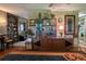 Spacious living room featuring hardwood floors, decorative shelving, and unique decor at 3751 Se 3Rd Ave, Ocala, FL 34471