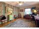 Home office featuring wood floors, large window, and built-in shelving at 3751 Se 3Rd Ave, Ocala, FL 34471