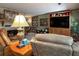 Spacious living room with a fireplace, built-in entertainment center and ample natural light at 3751 Se 3Rd Ave, Ocala, FL 34471