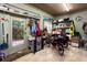 Storage or workshop area with shelving, door to backyard, and trike at 3751 Se 3Rd Ave, Ocala, FL 34471