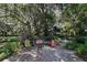 Relaxing brick patio with colorful chairs amidst a garden setting at 3751 Se 3Rd Ave, Ocala, FL 34471