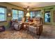 Inviting living room with two recliners, natural light, and access to backyard at 3751 Se 3Rd Ave, Ocala, FL 34471