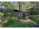 Charming ranch house surrounded by a beautifully maintained garden at 3751 Se 3Rd Ave, Ocala, FL 34471