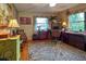 Home office with wood floors, built-in shelving, and a desk at 3751 Se 3Rd Ave, Ocala, FL 34471