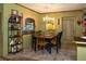 Charming dining room with a rustic table, chandelier, and unique decor at 3751 Se 3Rd Ave, Ocala, FL 34471
