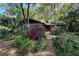 Charming house exterior with a lush garden and azaleas at 3751 Se 3Rd Ave, Ocala, FL 34471