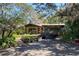 Single story home with carport and tropical landscaping at 3751 Se 3Rd Ave, Ocala, FL 34471