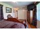 Comfortable bedroom with hardwood floors and a large dresser at 3751 Se 3Rd Ave, Ocala, FL 34471