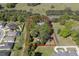 Aerial lot view showing property boundaries, surrounded by trees and neighboring homes at 3751 Se 3Rd Ave, Ocala, FL 34471