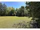 Open grassy yard with mature trees at 3751 Se 3Rd Ave, Ocala, FL 34471