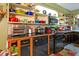 Kitchen boasts ample storage, colorful cookware, and a breakfast bar at 3751 Se 3Rd Ave, Ocala, FL 34471
