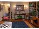 Living room with patterned wallpaper, console table, and animal-themed decor at 3751 Se 3Rd Ave, Ocala, FL 34471