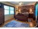Large bedroom with a comfortable bed, ample closet space, and hardwood floors at 3751 Se 3Rd Ave, Ocala, FL 34471