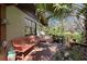 Wooden deck with a bench and lush landscaping surrounding it at 3751 Se 3Rd Ave, Ocala, FL 34471