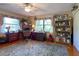 Bright home office with wood floors, built-in shelving, and a desk at 3751 Se 3Rd Ave, Ocala, FL 34471