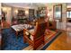 Living room boasts hardwood floors, a zebra-print ottoman, and an eclectic decor style at 3751 Se 3Rd Ave, Ocala, FL 34471