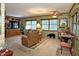 Relaxing living room featuring comfortable recliners, built-in shelving, and a cozy atmosphere at 3751 Se 3Rd Ave, Ocala, FL 34471