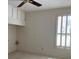 Spacious bedroom with ceiling fan and window shutters at 610 Grand Vista Trl, Leesburg, FL 34748
