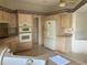 Eat-in kitchen with stainless steel dishwasher and refrigerator at 610 Grand Vista Trl, Leesburg, FL 34748