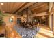 Open dining room with hardwood floors, a large table, and views to the living room at 2162 Se Mill Creek Cir, Ocala, FL 34471