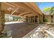 Brick-paved covered entry with stone pillars at 2162 Se Mill Creek Cir, Ocala, FL 34471
