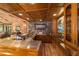 Custom wet bar featuring wood finishes, stonework, and a stained-glass accent at 2162 Se Mill Creek Cir, Ocala, FL 34471