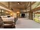 Spacious main bedroom with high ceilings, large windows, and a cozy sitting area at 2162 Se Mill Creek Cir, Ocala, FL 34471