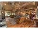 Large living room with hardwood floors, high ceilings and stone fireplace at 2162 Se Mill Creek Cir, Ocala, FL 34471
